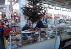 traders and shoppers in market hall