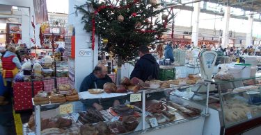 traders and shoppers in market hall