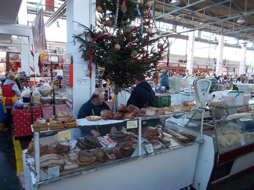 traders and shoppers in market hall