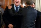 Colleagues laughing together at work