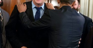 Colleagues laughing together at work